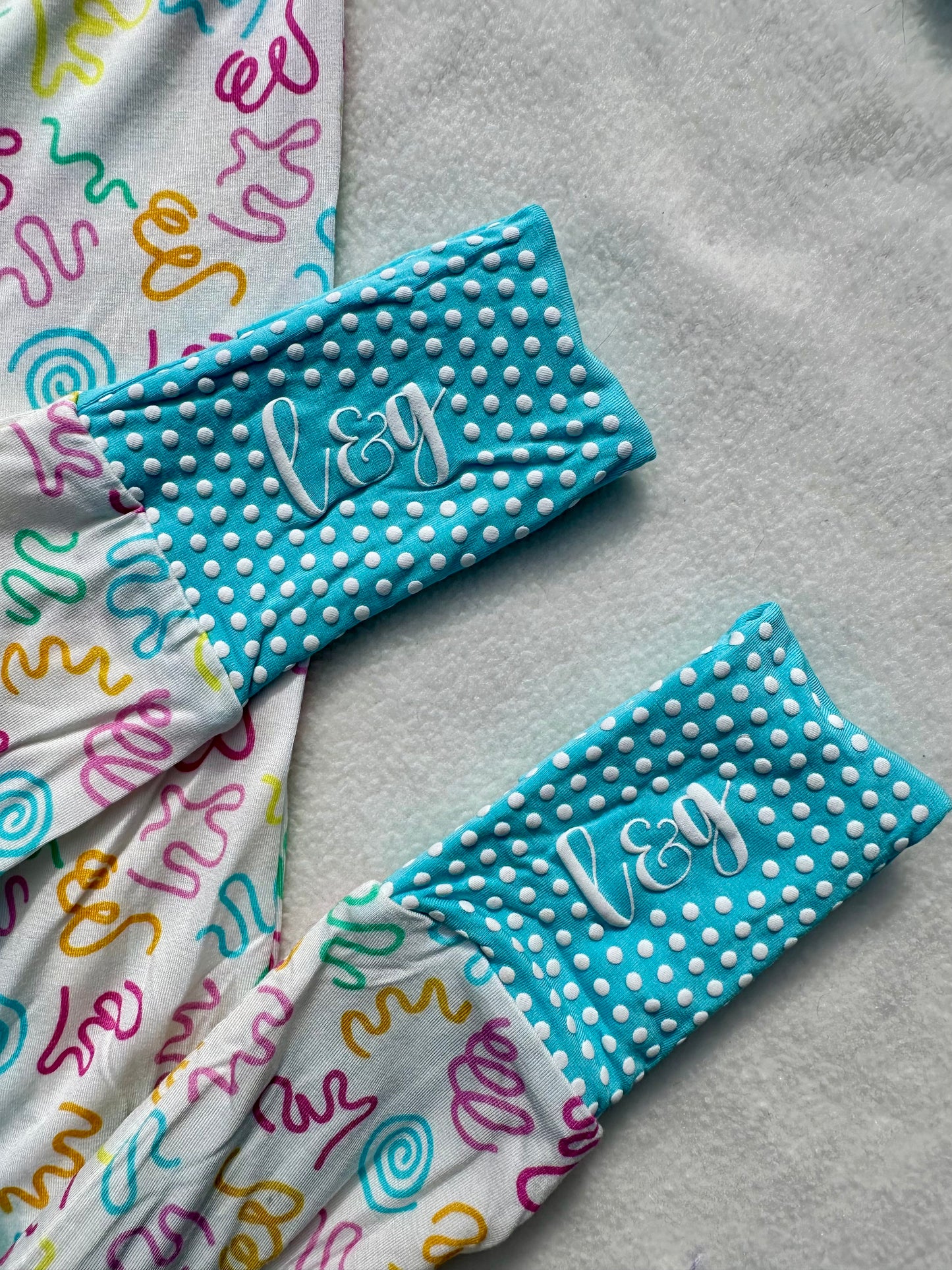 squiggles & wiggles zip romper